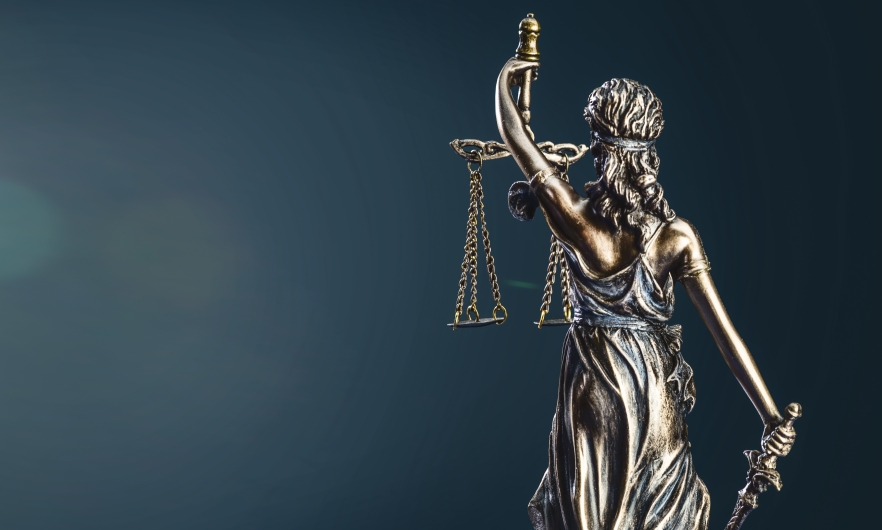 A lady justice sculpture turned backward
