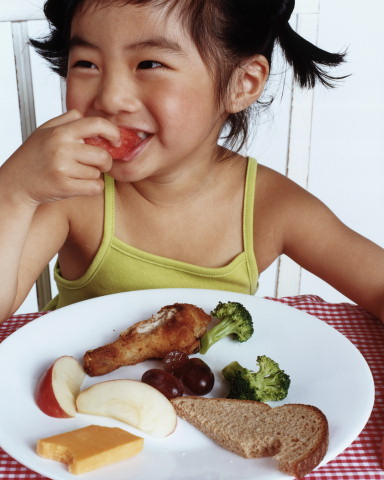 child eating and smiling