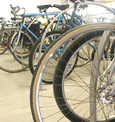 Rows of bicycles occupy parking spaces normally reserved for cars in the School's garage.