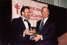 Dr. Peter Smith, (r) chair of American Lung Association of NYC, hands award to Mayor Bloomberg.