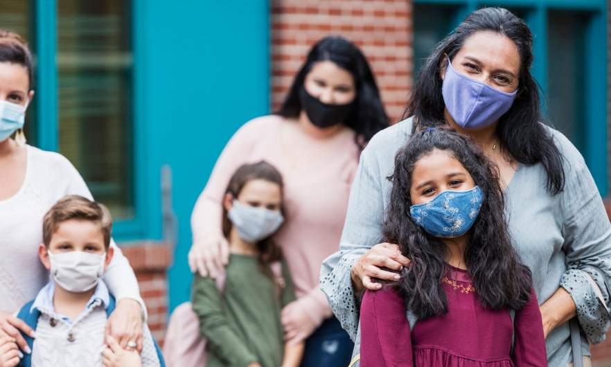 Moms with children wearing masks 