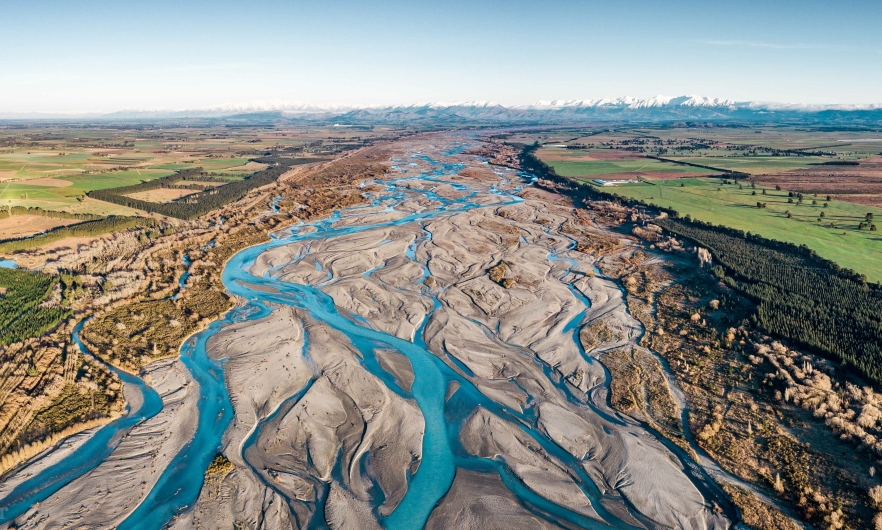 Overlooking a braided river in New Zealand, heading towards the horizon
