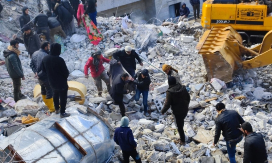 Rescuers amid earthquake damage in Idlib, Syria