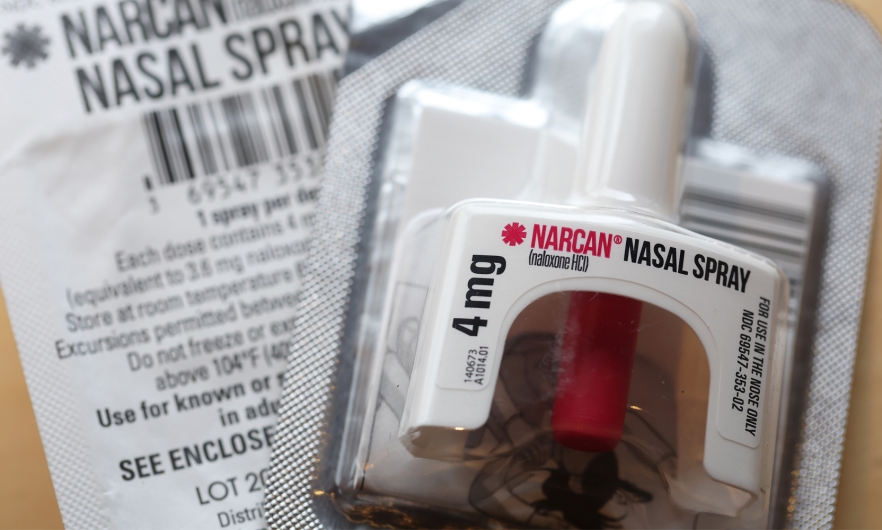 Narcan spray with its package insert.
