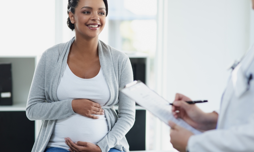 Pregnant woman with physician