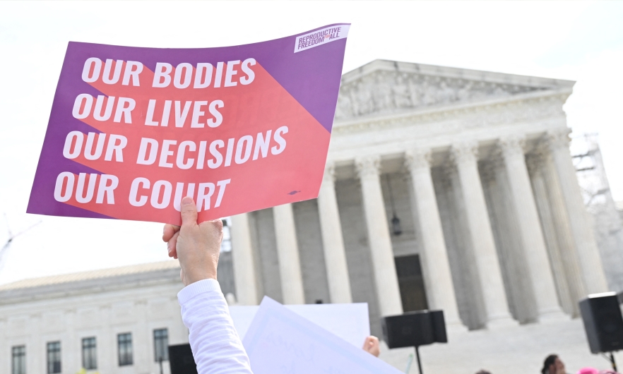 Pro-abortion activists rally for "reproductive rights and emergency abortion care" outside the U.S. Supreme Court in Washington, D.C., on April 24, 2024. Saul Loeb/AFP via Getty Images
