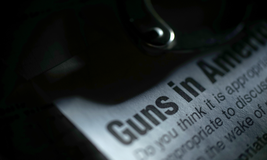 Headline reading guns in america