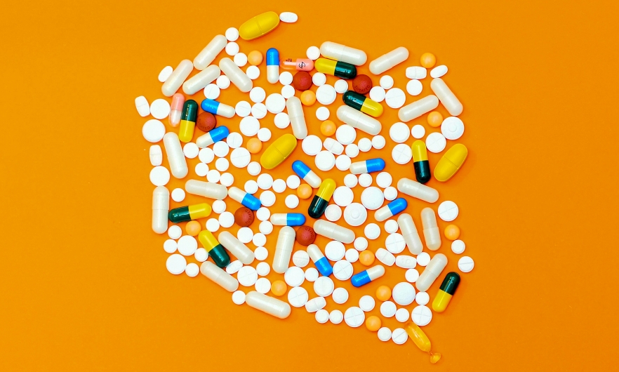 Drugs and pills on an orange background