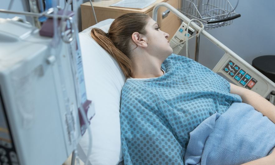 Woman in hospital bed