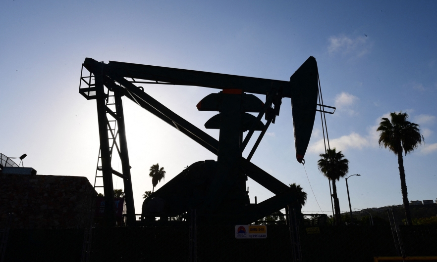 An oil pumpjack is viewed in Signal Hill, south of Los Angeles, California, on April 21, 2020.