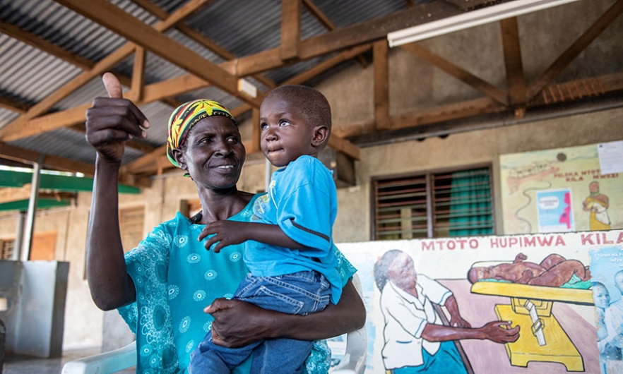 A mother at Kakuma District Hospital, Kenya, is happy that her child is HIV-free, thanks to prevention of mother-to-child transmission services. Eric Bond/Elizabeth Glaser Pediatric AIDS Foundation 2019.