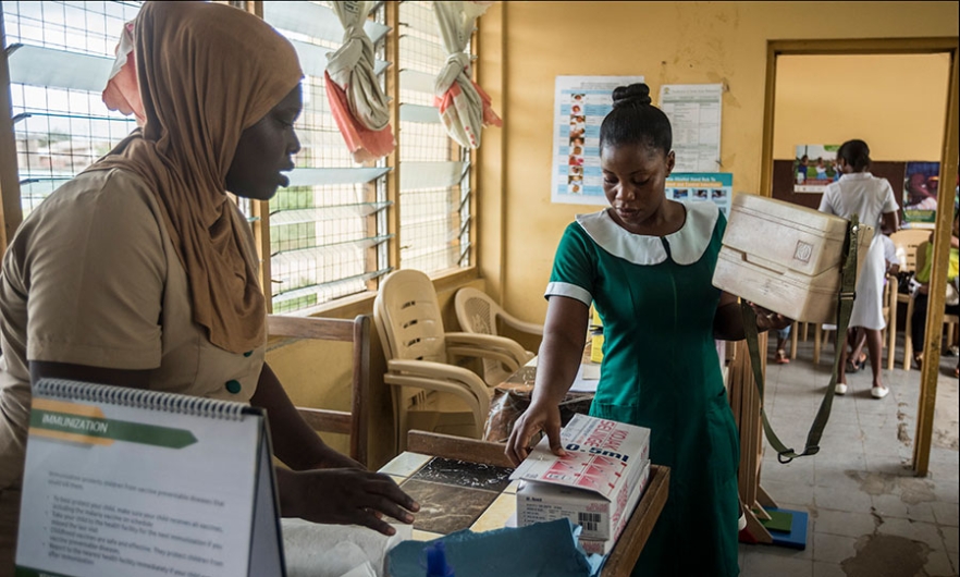 A nurse carries a container with Malaria vaccine Mosquirix at Ewim Polyclinic in Cape Coast, Ghana, on April 30, 2019. Image: Cristina Aldehuela/AFP/Getty