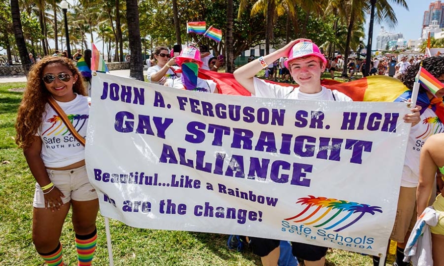 Teens holding a banner for Gay Straight Alliance at the Gay Pride Parade on &#039;Ocean Drive&#039;. Image: Jeffrey Greenberg/Universal Images Group