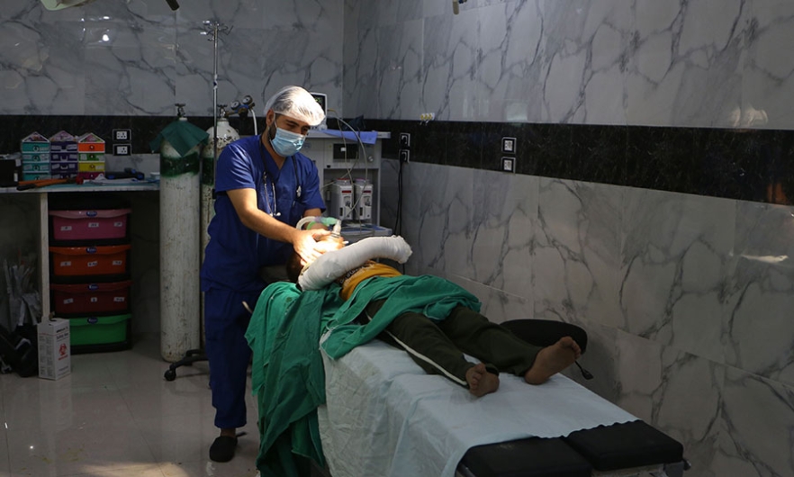 A Syrian doctor checks on a child after a surgery at a hospital in Syria&#039;s Idlib province, September 10, 2018. Image: Aaref WATAD/AFP/Getty