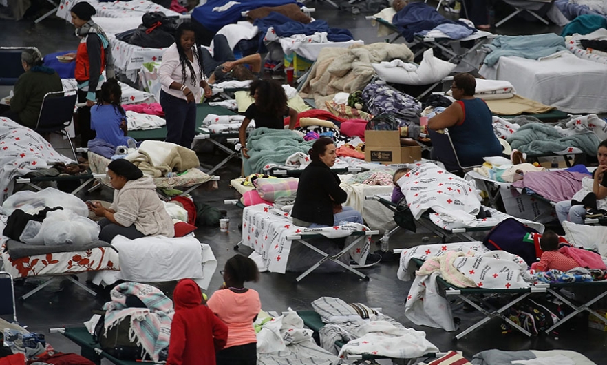 People take shelter after flood waters from Hurricane Harvey inundated Houston, Texas. August 29, 2017. Image: Joe Raedle/Getty