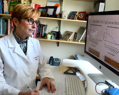 Sabra Klein in COVID lab
