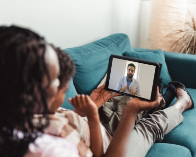 Woman with child on a telehealth call