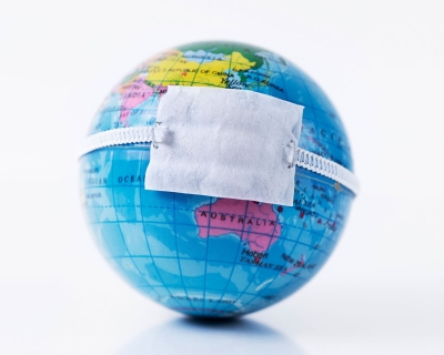 World globe with a mask 