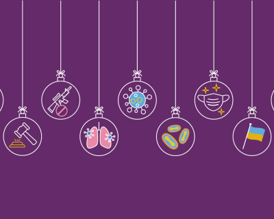 Purple background with holiday ornaments hanging