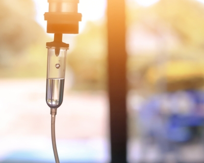A photograph of an intravenous drip. 