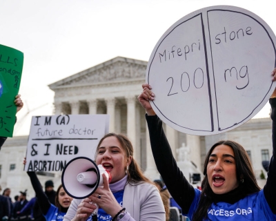 Abortion rights supporters rally in front of the U.S. Supreme Court on March 26, when the court began hearing arguments on access to the drug mifepristone.