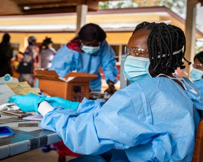 A health worker prepares a vaccination certificate after administering a COVID-19 vaccine in Bimbo, near Bangui, on November 15, 2021. Image: Barbara DEBOUT / AFP via Getty