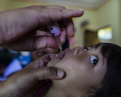 A child looks uncertain as he receives a polio vaccine at a health care center in Bogor, West Java, Indonesia, on April 3, 2023. Aditya Aji/AFP via Getty 
