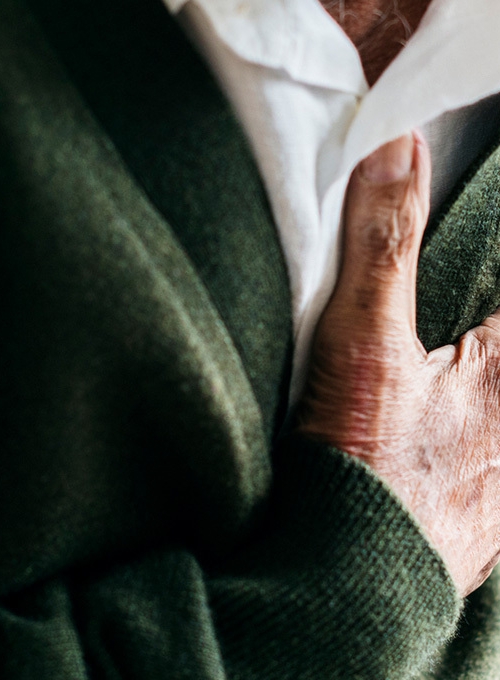 elderly man holding his chest