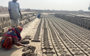 Brick kiln workers laying bricks in Pakistan