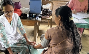 Taking blood pressure in West Garo Hills, Meghalaya state, India