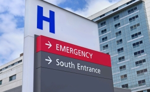 Outdoor sign that reads Emergency and South Entrance