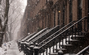 Brownstone rowhomes in light snowfall