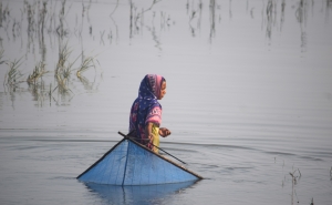 Teenager Hasina Begum fishing in the salty Kholpetua River in southwestern Bangladesh. 