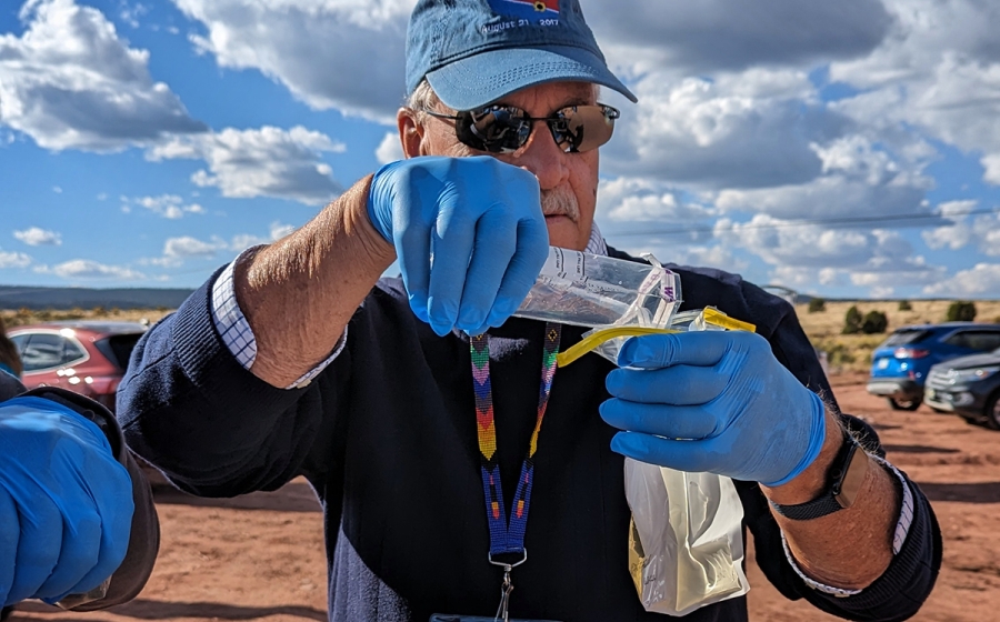 Bill Clarke tests water samples at the Diné Water Lifeways Project in Arizona