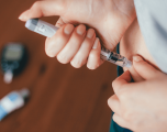 A patient self-administers insulin
