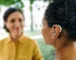 A woman wearing a hearing aid