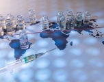 A world map with covid vaccine an syringes distributed