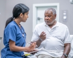Elderly man consulting with a doctor 