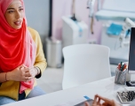 Patient talks with their doctor in a medical office