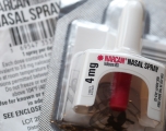 Narcan spray with its package insert.