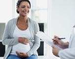 Pregnant woman with physician