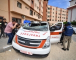 Members of the press take photographs of a damaged ambulance in an Israeli army attack as clashes between Palestinian factions and Israeli forces continue in Khan Yunis, Gaza on October 07, 2023. The paramedics inside the unusable ambulance were seriously injured.