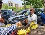 Extreme heat means few customers and little rest for Habib Khan, 65, a banana vendor outside Delhi.  Image: Swagata Yadavar