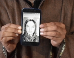 Javed Ahmed Padroo displays a photo of his wife, Ruqiya Javed, on his cellphone. Anantnag, Kashmir, April 21. 