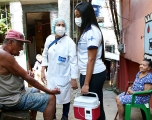COVID-19 Vaccinators talk with residents in Rio de Janeiro, Brazil
