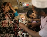 A baby who is suffering from respiratory disease receives treatment inside at Dhaka Shishu Hospital in Dhaka, Bangladesh, February 24, 2021. Syed Mahamudur Rahman/NurPhoto via Getty Images.