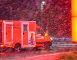 An ambulance drives through Laatzen, Germany in heavy snow during a surge in COVID-19 cases on January 31, 2022.