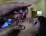 A child looks uncertain as he receives a polio vaccine at a health care center in Bogor, West Java, Indonesia, on April 3, 2023. Aditya Aji/AFP via Getty 
