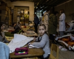 A Ukrainian girl draws in a bomb shelter at the Okhmadet Children&#039;s Hospital on March 01, 2022 in Kyiv. Chris McGrath/Getty Images
