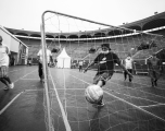 Mario Noa Pariona scores a goal during a soccer match at the Plaza de Acho bullring. 